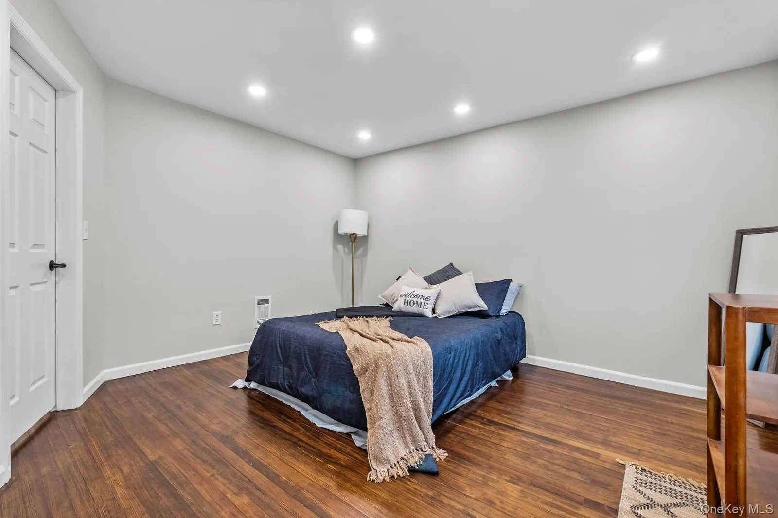Bedroom with recessed lighting and dark wood-style floors Bedroom with recessed lighting and dark wood-style floors
