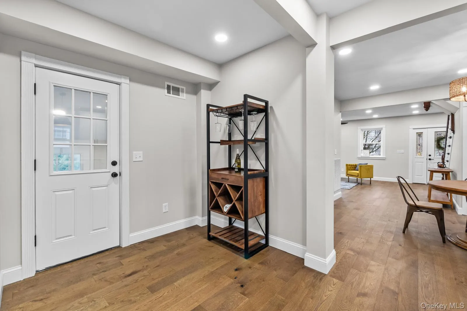 Entrance foyer featuring light wood-type flooring and recessed lighting Entrance foyer featuring light wood-type flooring and recessed lighting