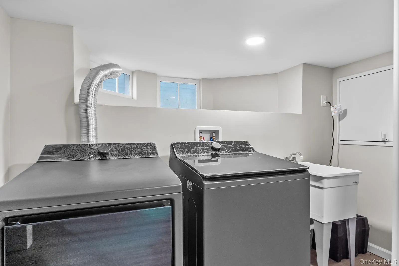 Washroom with separate washer and dryer Washroom with separate washer and dryer