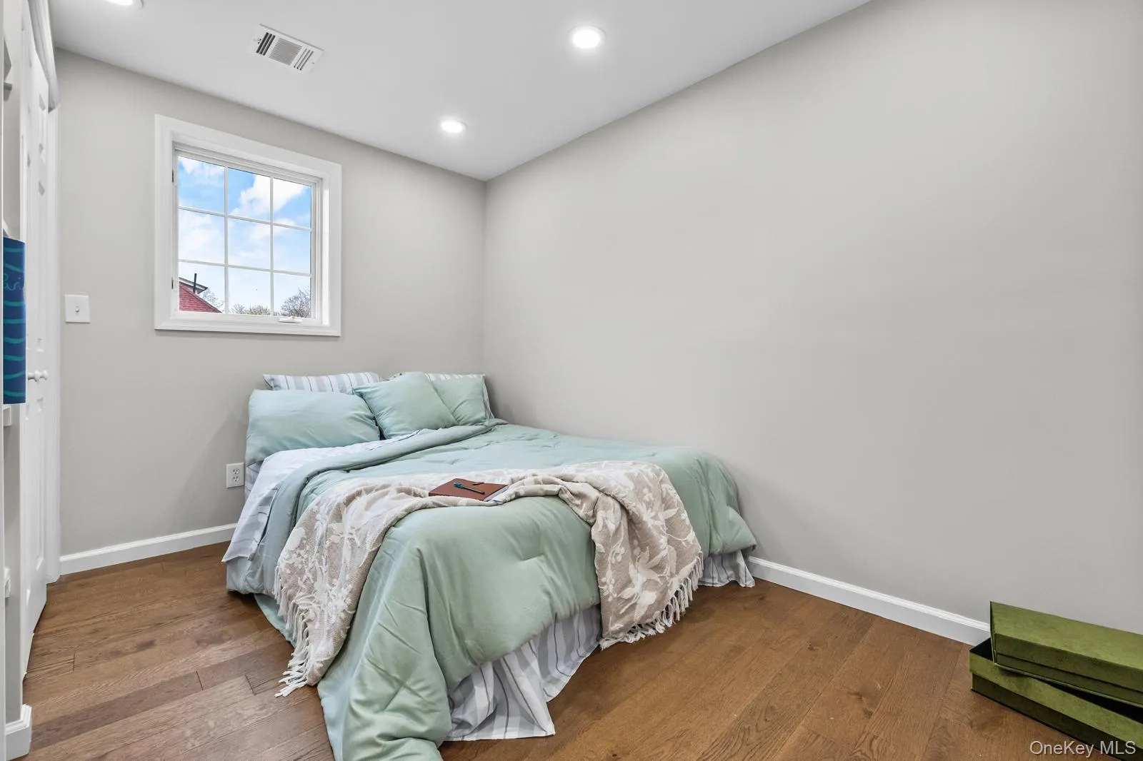 Bedroom featuring hardwood / wood-style floors and recessed lighting Bedroom featuring hardwood / wood-style floors and recessed lighting