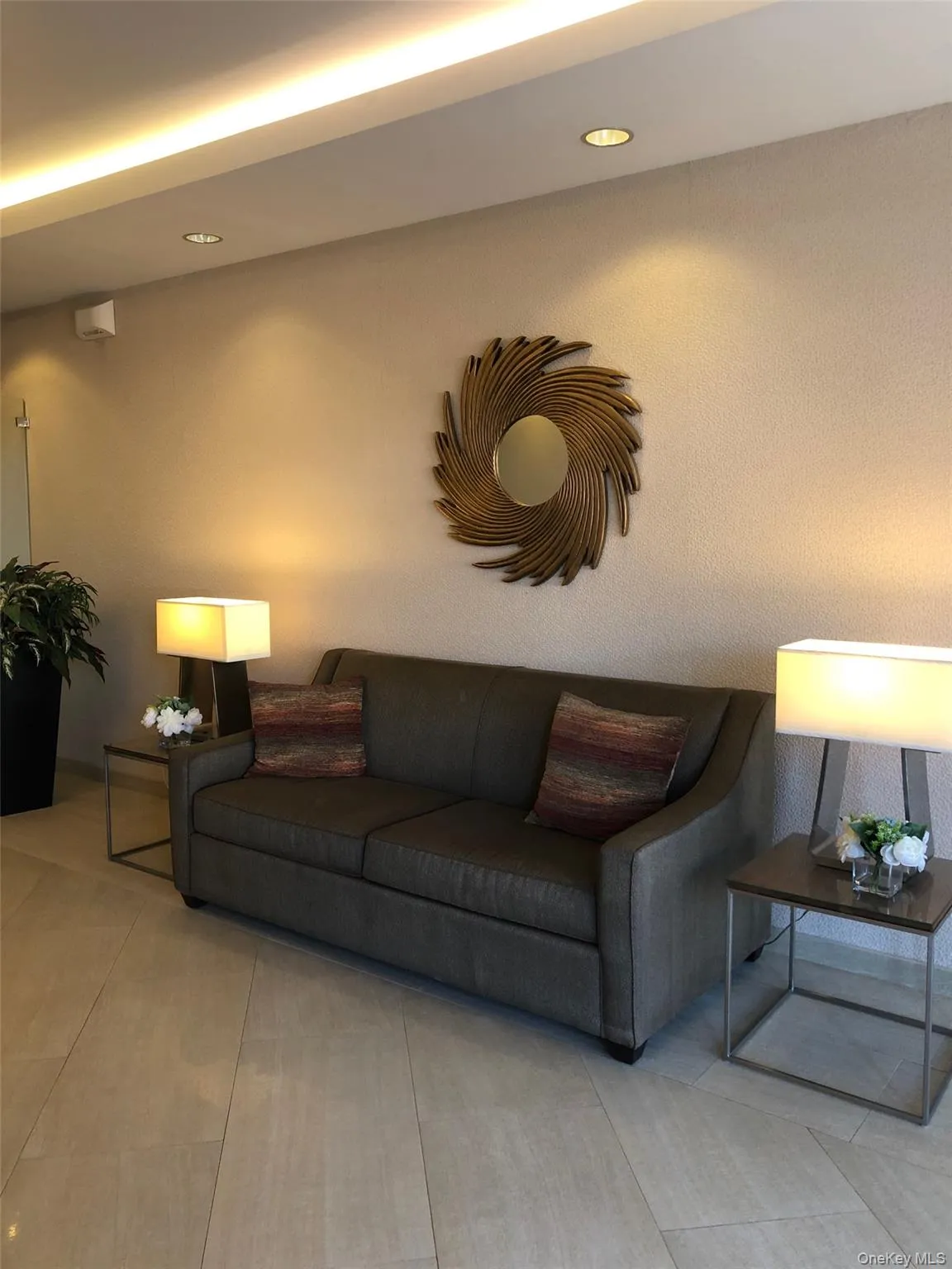 Tiled living area featuring recessed lighting Tiled living area featuring recessed lighting