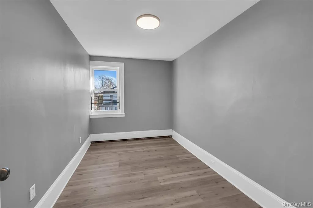 Bedroom featuring baseboards and light wood-style floors Bedroom featuring baseboards and light wood-style floors