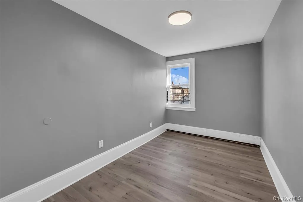 Bedroom with baseboards and light wood-type flooring Bedroom with baseboards and light wood-type flooring