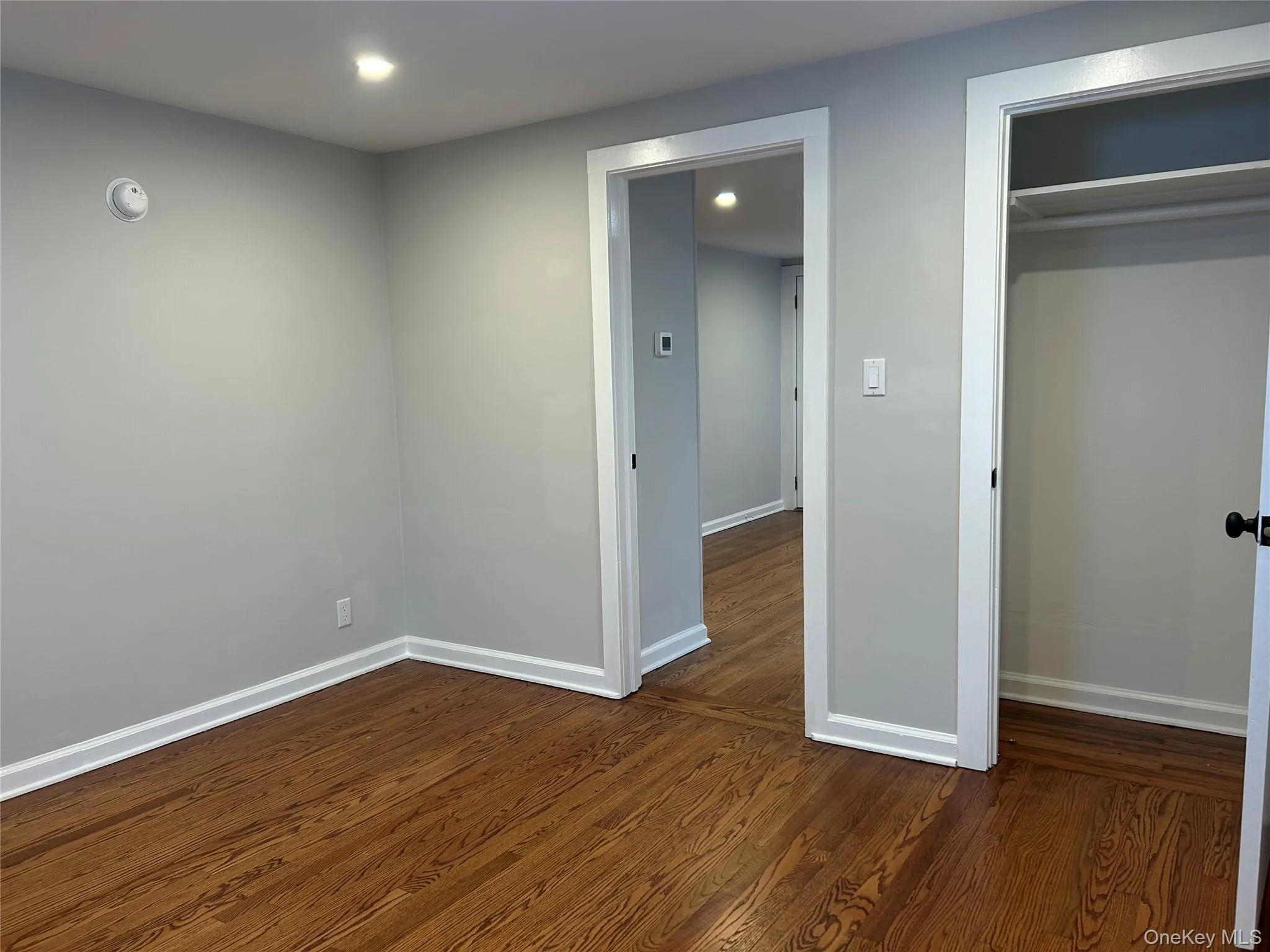 Unfurnished bedroom featuring dark wood finished floors, recessed lighting, and a closet Unfurnished bedroom featuring dark wood finished floors, recessed lighting, and a closet