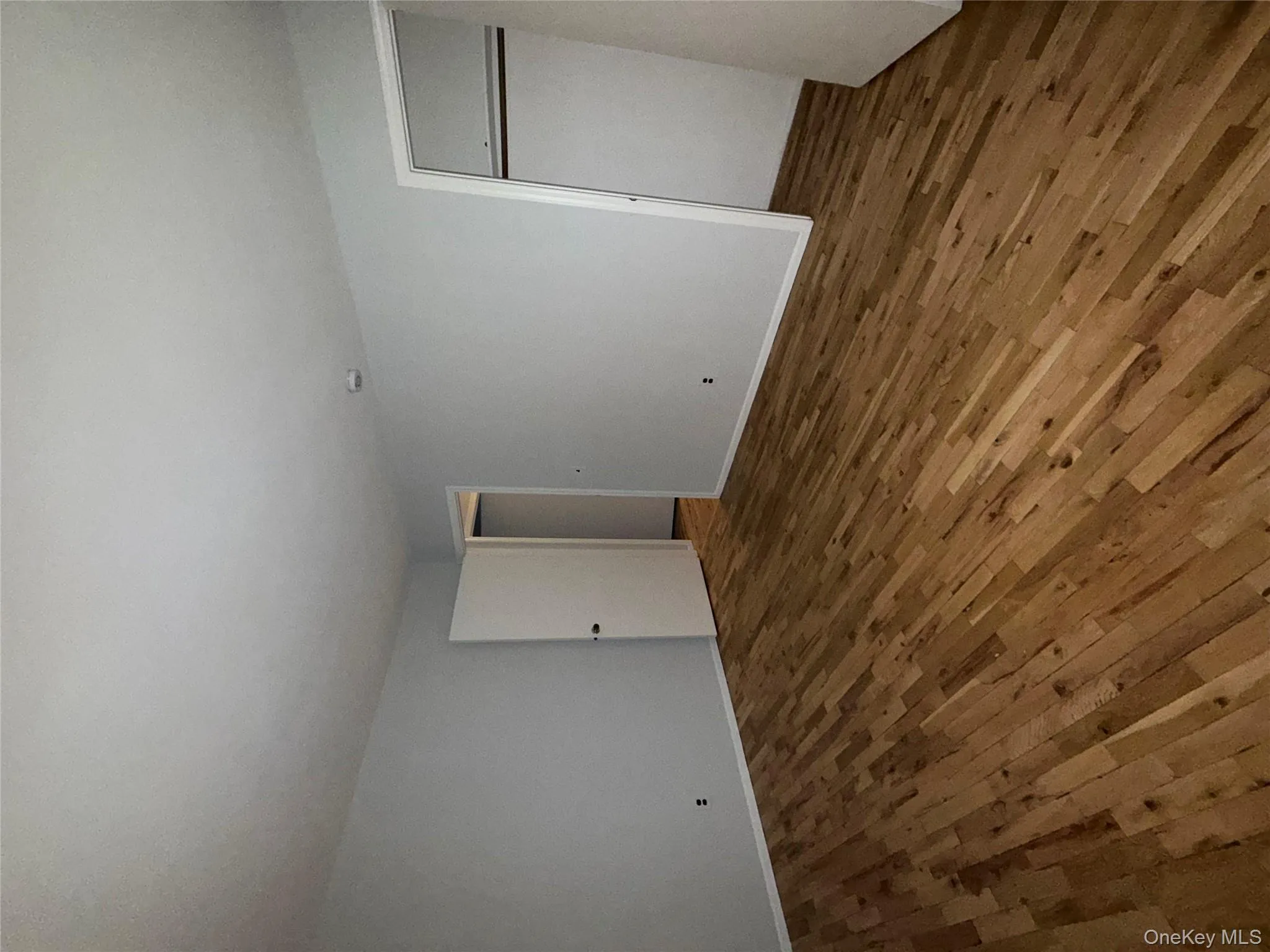 Unfurnished bedroom featuring hardwood / wood-style floors and a closet Unfurnished bedroom featuring hardwood / wood-style floors and a closet