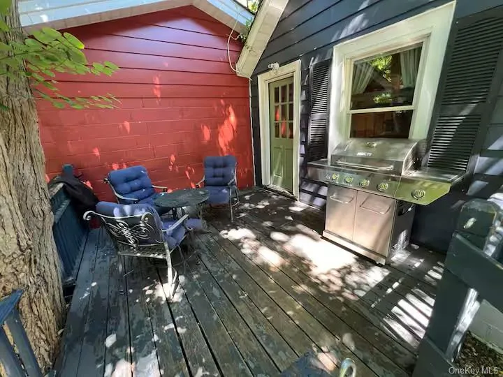 Wooden deck featuring area for grilling Wooden deck featuring area for grilling