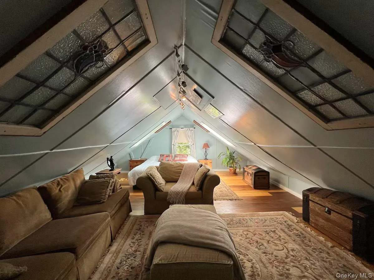 Bonus room with wood finished floors and lofted ceiling Bonus room with wood finished floors and lofted ceiling