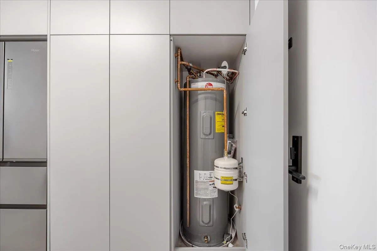 Utility room with water heater Utility room with water heater