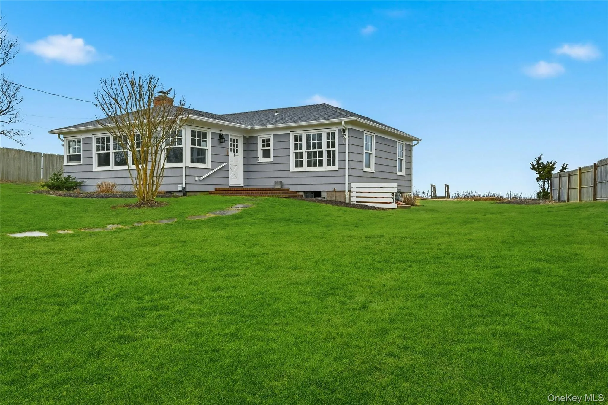 Rear view of house featuring a chimney Rear view of house featuring a chimney