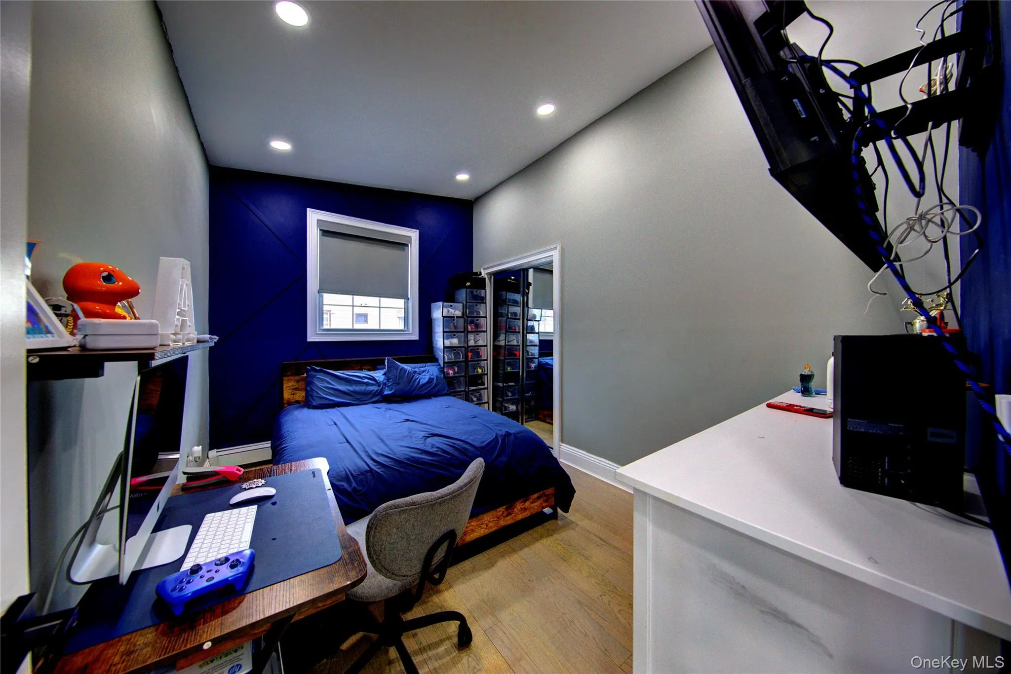 Bedroom featuring an office area, light wood-style floors, and recessed lighting Bedroom featuring an office area, light wood-style floors, and recessed lighting