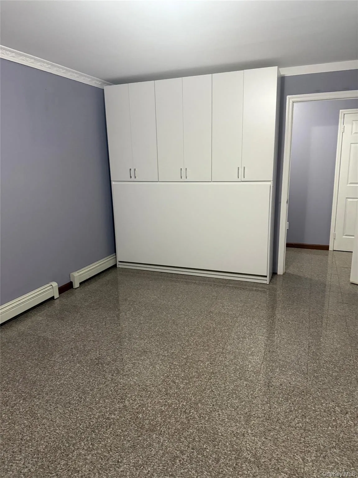 Spare room featuring baseboard heating Spare room featuring baseboard heating