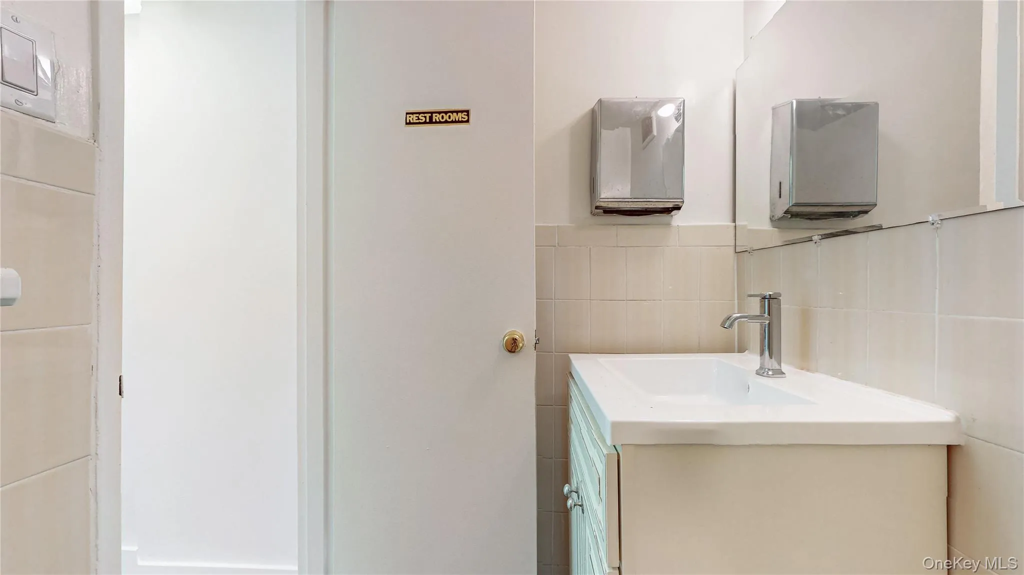 Bathroom with tile walls and vanity Bathroom with tile walls and vanity