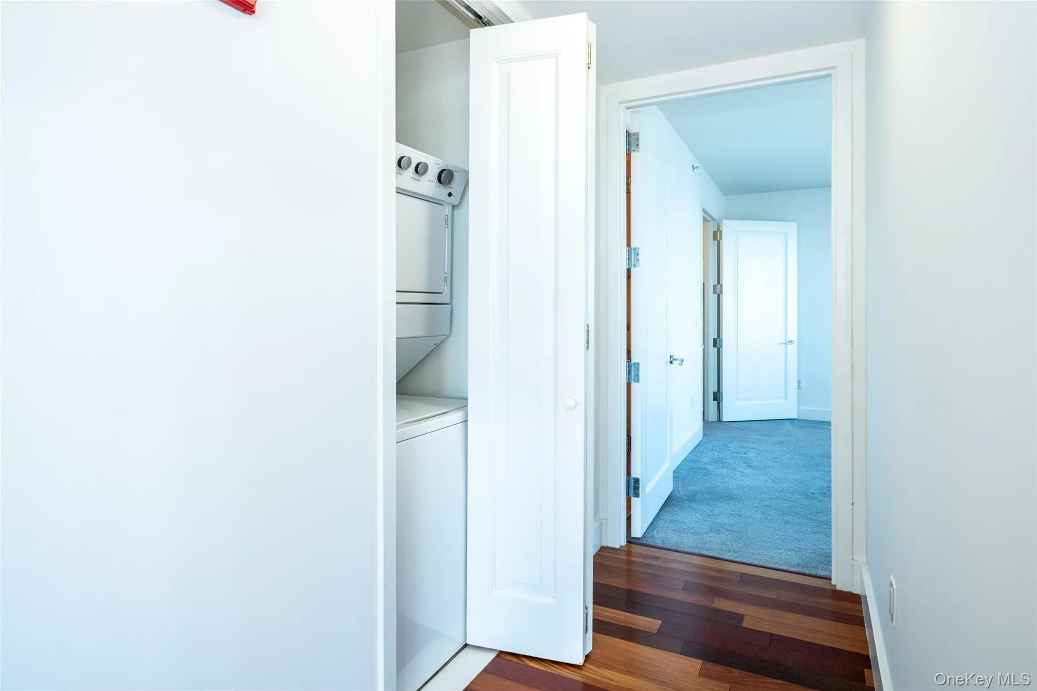 Stacked washing machine and dryer in unit Stacked washing machine and dryer in unit