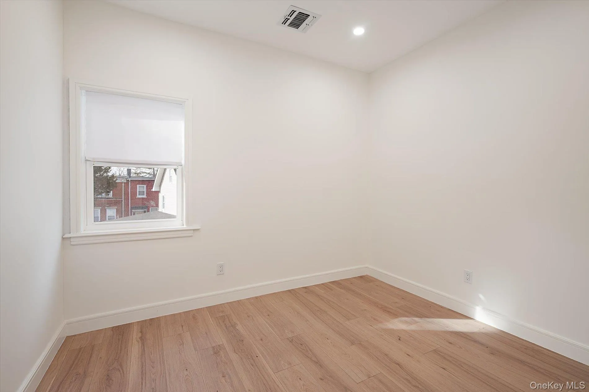 Unfurnished room featuring light wood-style flooring and recessed lighting Unfurnished room featuring light wood-style flooring and recessed lighting