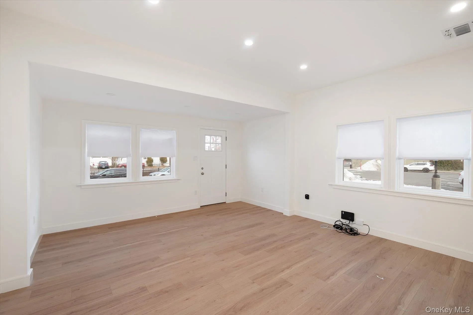 Entryway featuring light wood finished floors and recessed lighting Entryway featuring light wood finished floors and recessed lighting