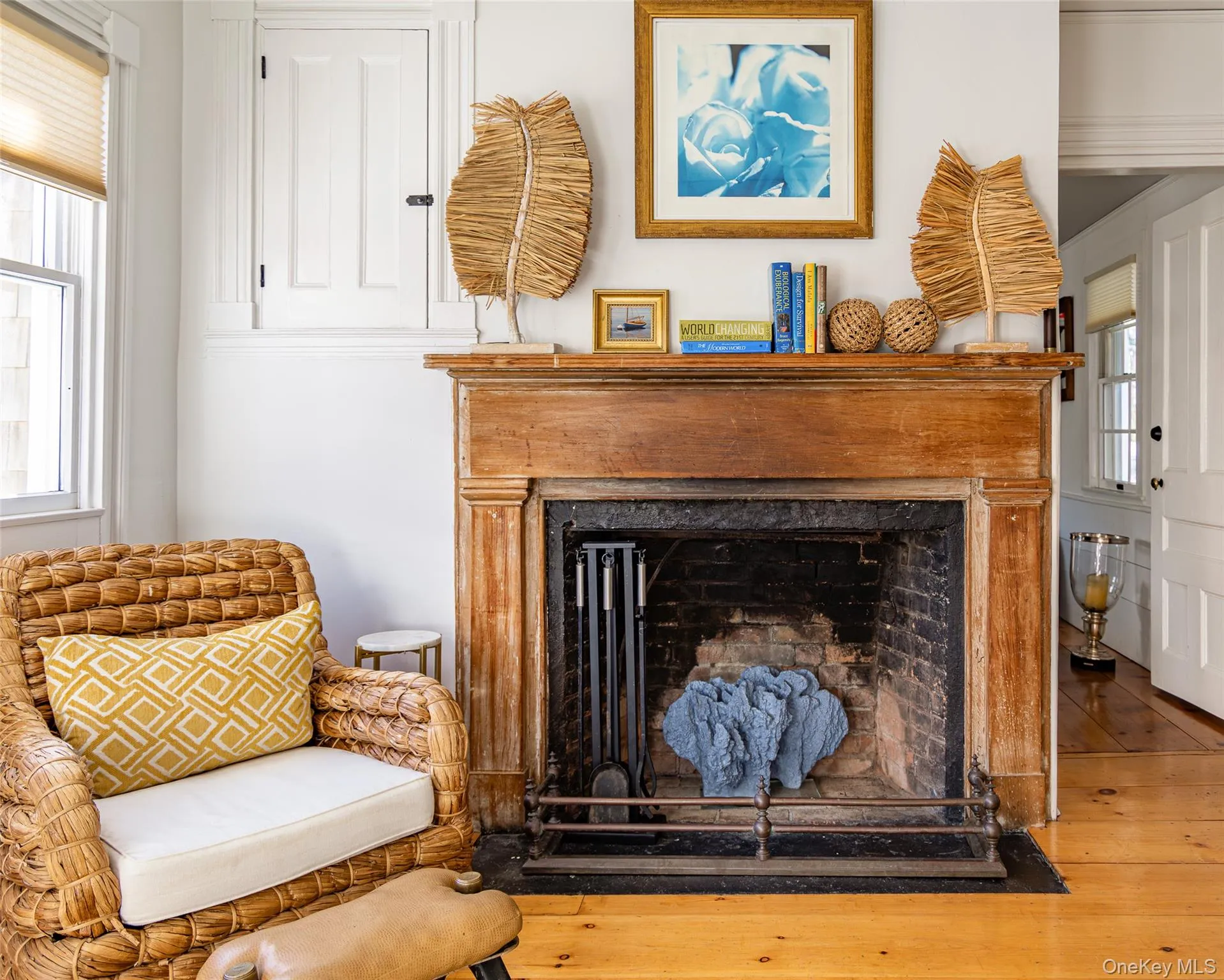 Detailed view of a fireplace and wood finished floors Detailed view of a fireplace and wood finished floors