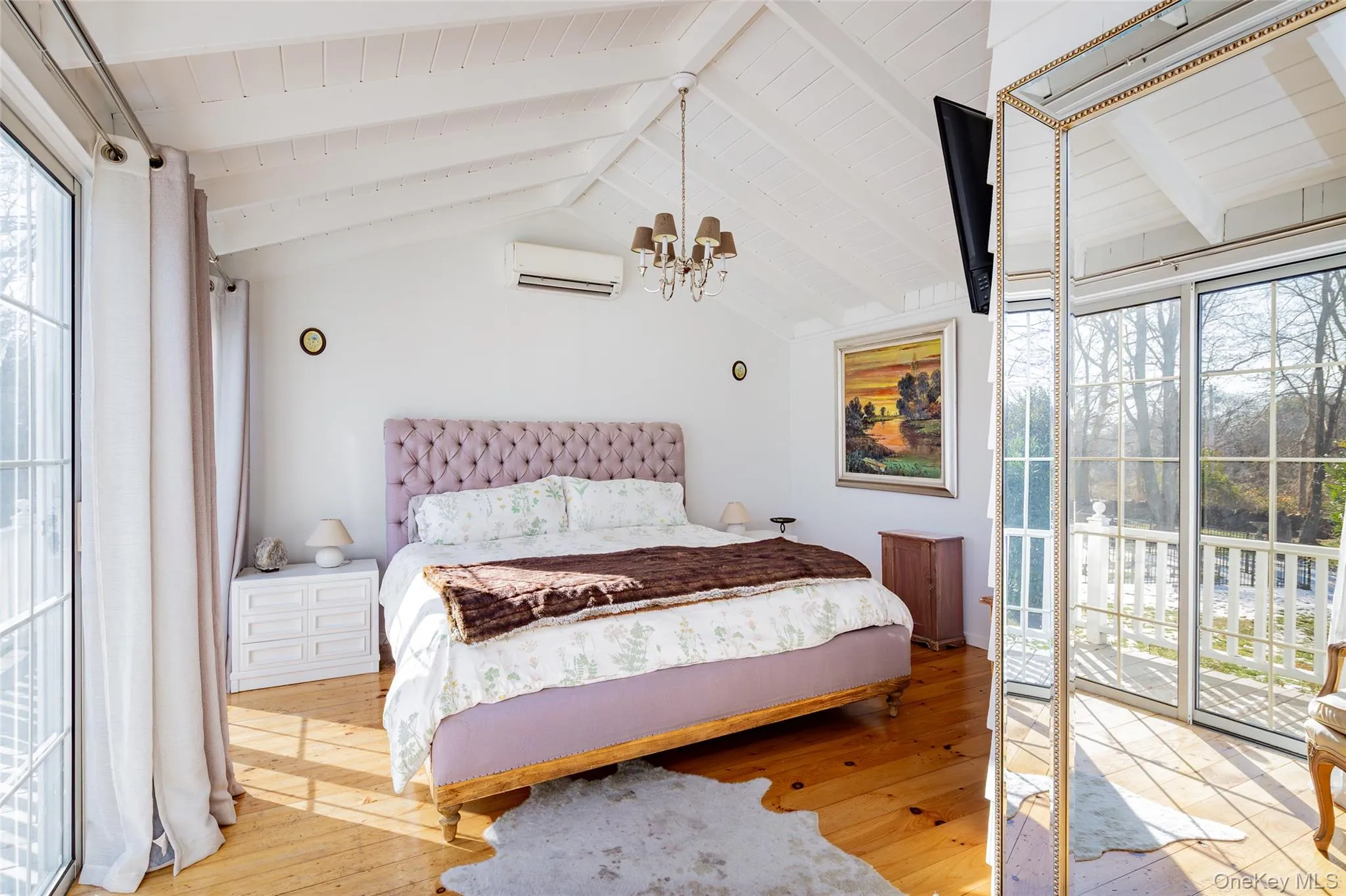 Bedroom with access to exterior, light wood-type flooring, a chandelier, an AC wall unit, and wooden ceiling Bedroom with access to exterior, light wood-type flooring, a chandelier, an AC wall unit, and wooden ceiling