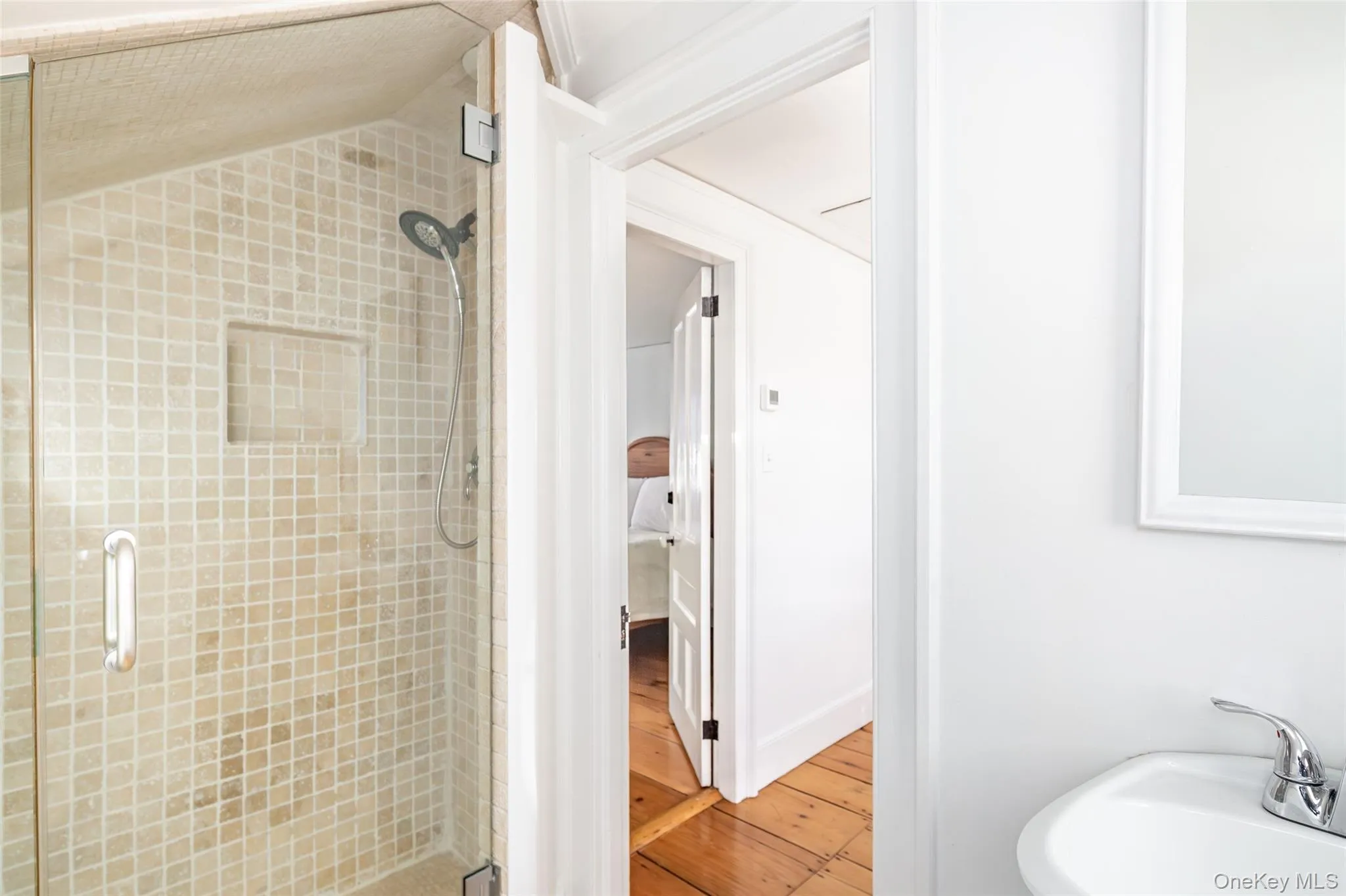 Full bathroom with a stall shower and light wood-style flooring Full bathroom with a stall shower and light wood-style flooring