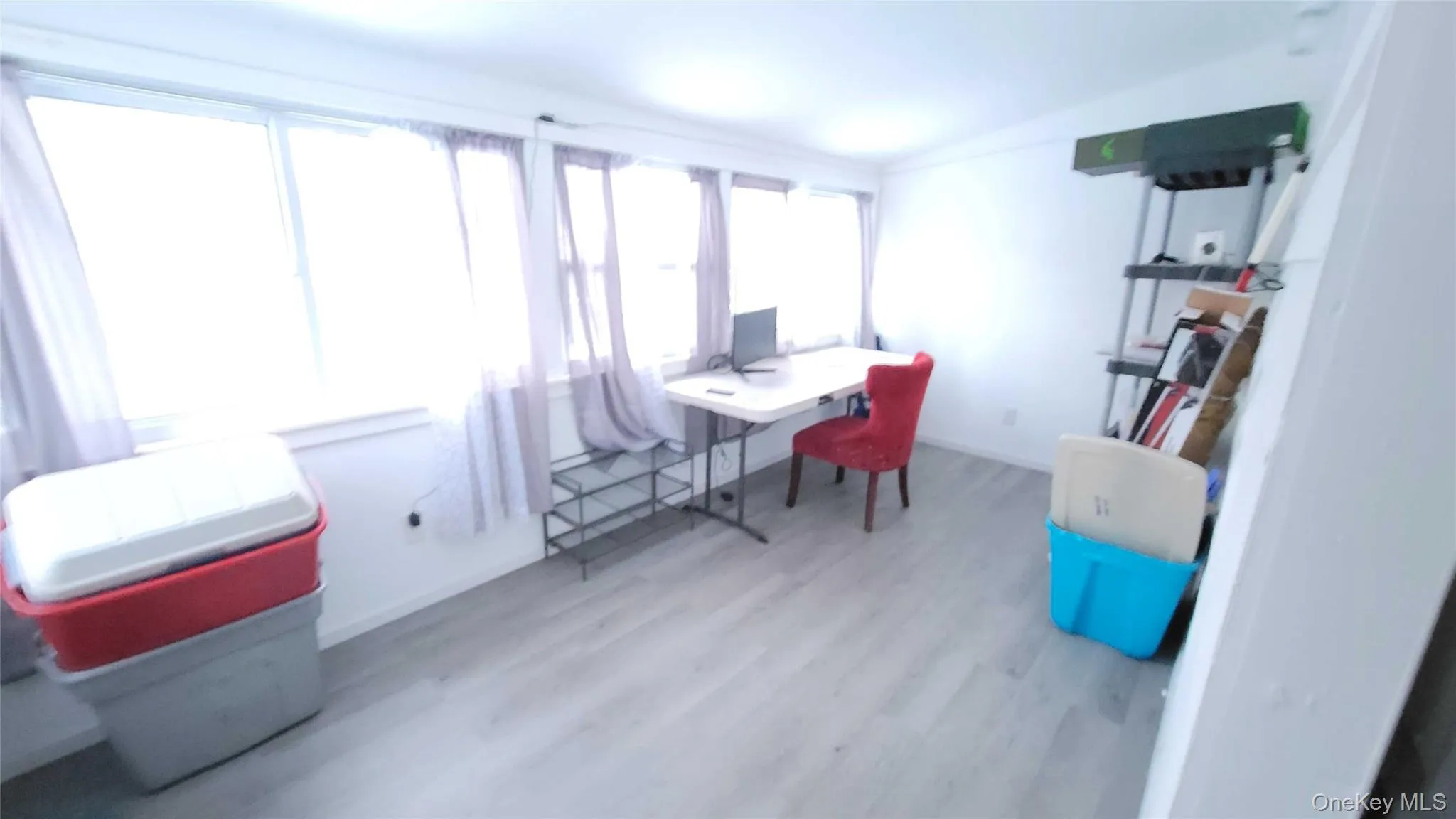 Office with lofted ceiling and light wood finished floors Office with lofted ceiling and light wood finished floors