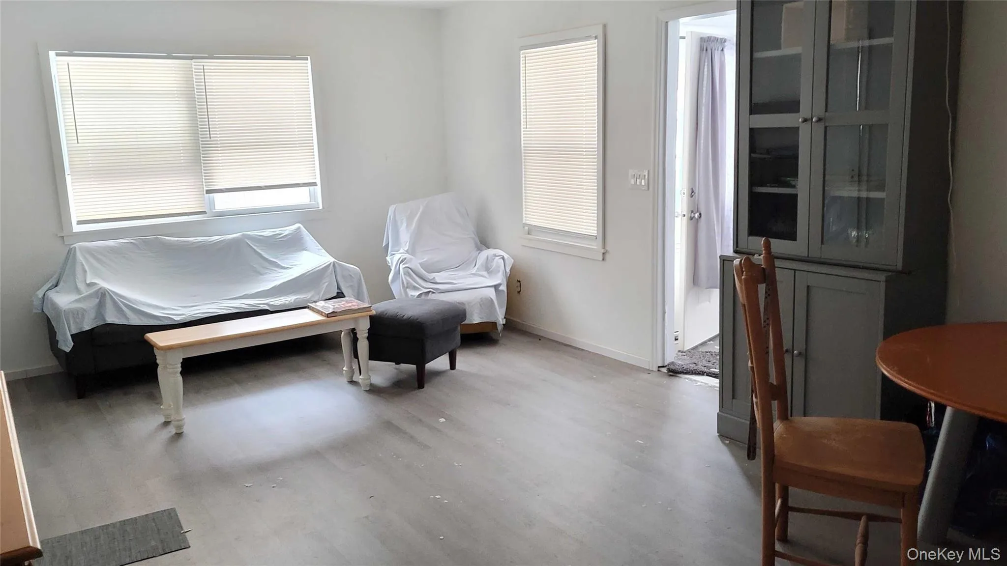 Sitting room with light wood-type flooring and baseboards Sitting room with light wood-type flooring and baseboards