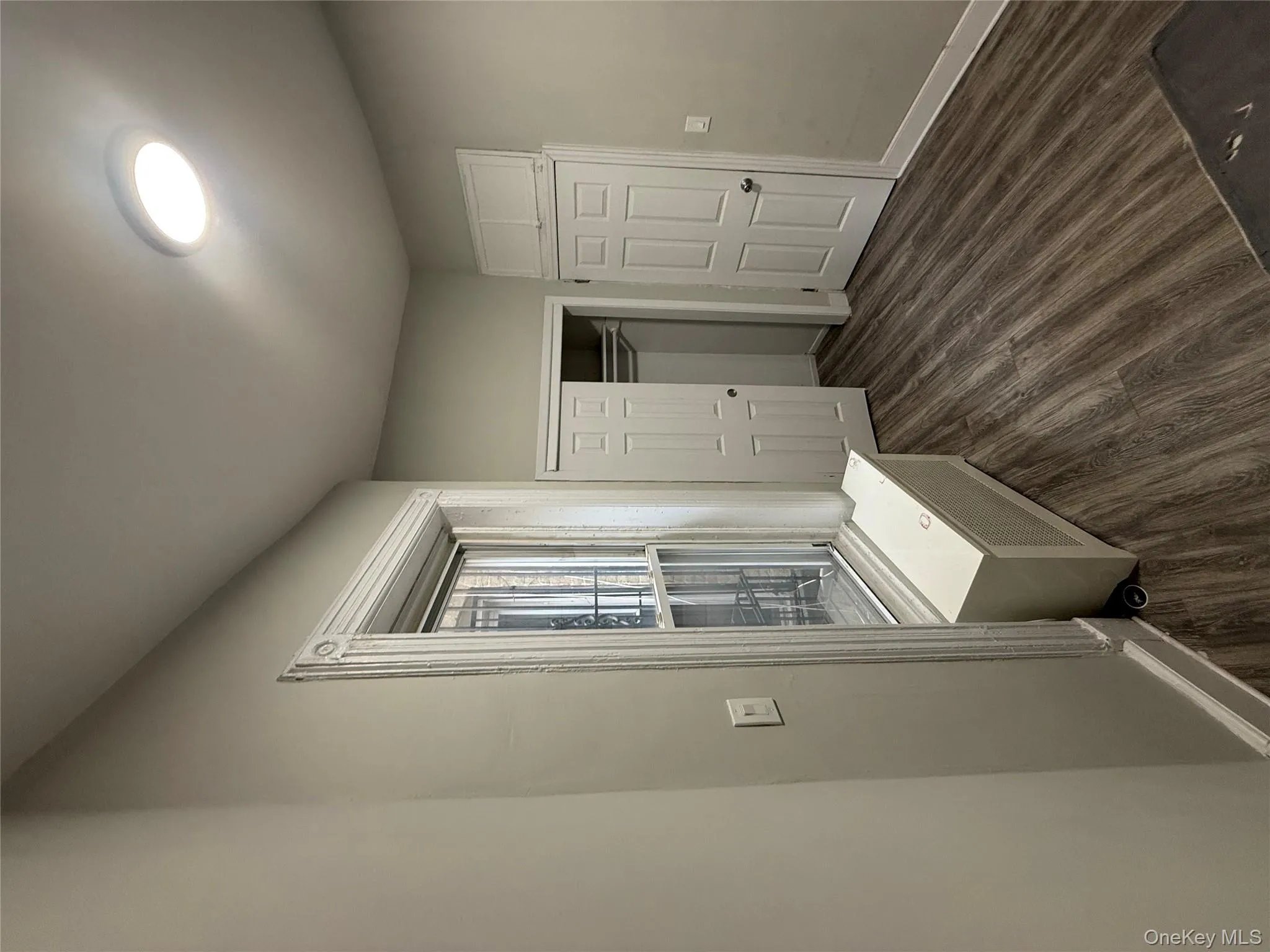 Mudroom featuring dark wood finished floors and baseboards Mudroom featuring dark wood finished floors and baseboards