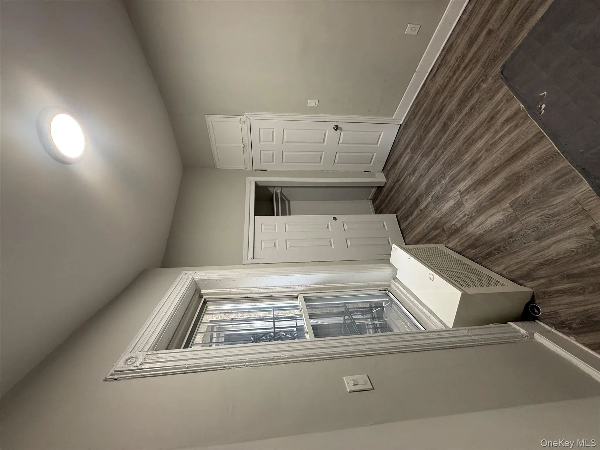 Mudroom with dark wood-style flooring and baseboards Mudroom with dark wood-style flooring and baseboards