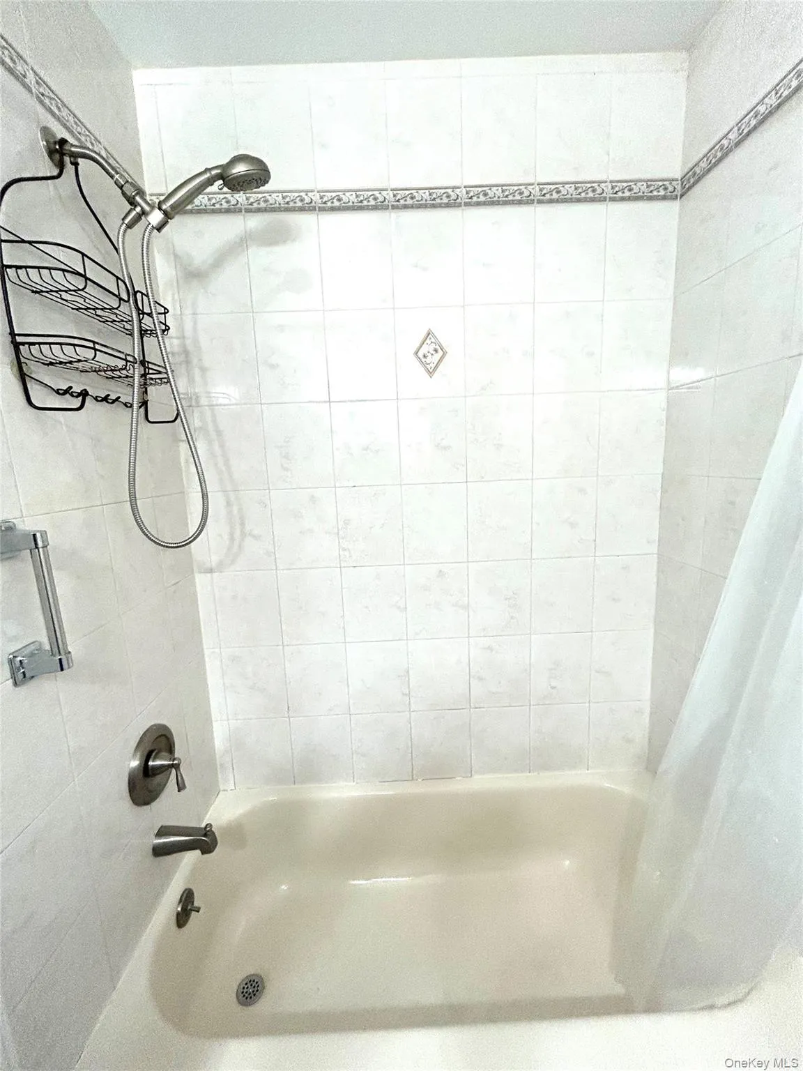 Full bathroom with shower / bath combo Full bathroom with shower / bath combo