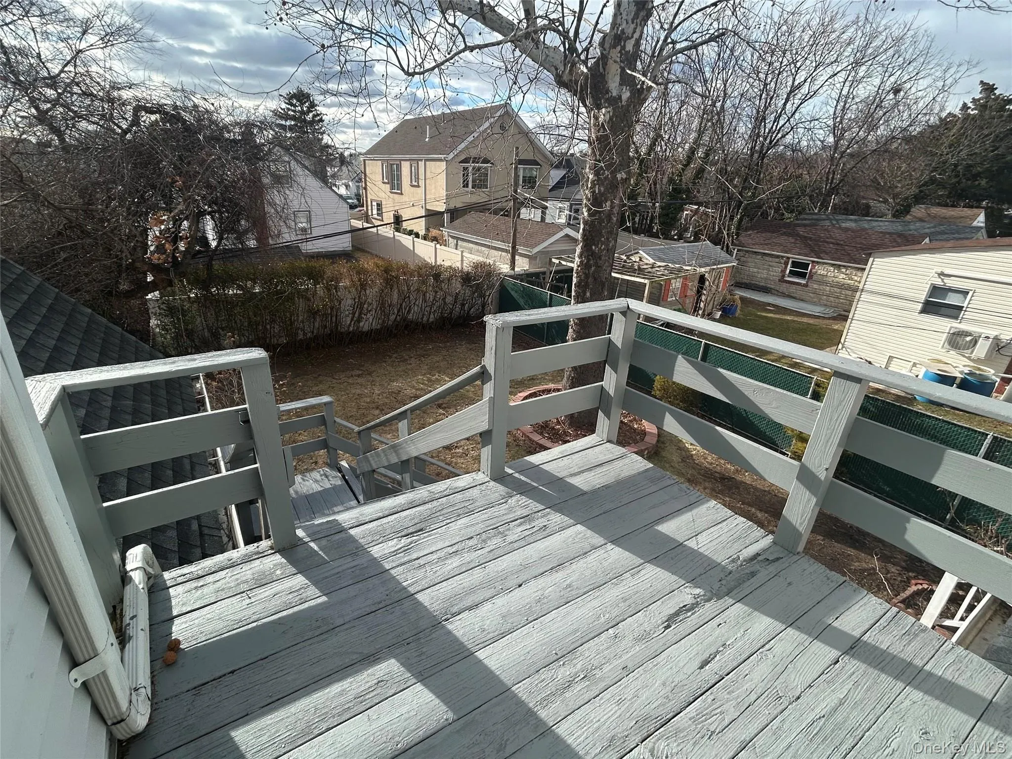 Wooden terrace featuring a residential view Wooden terrace featuring a residential view