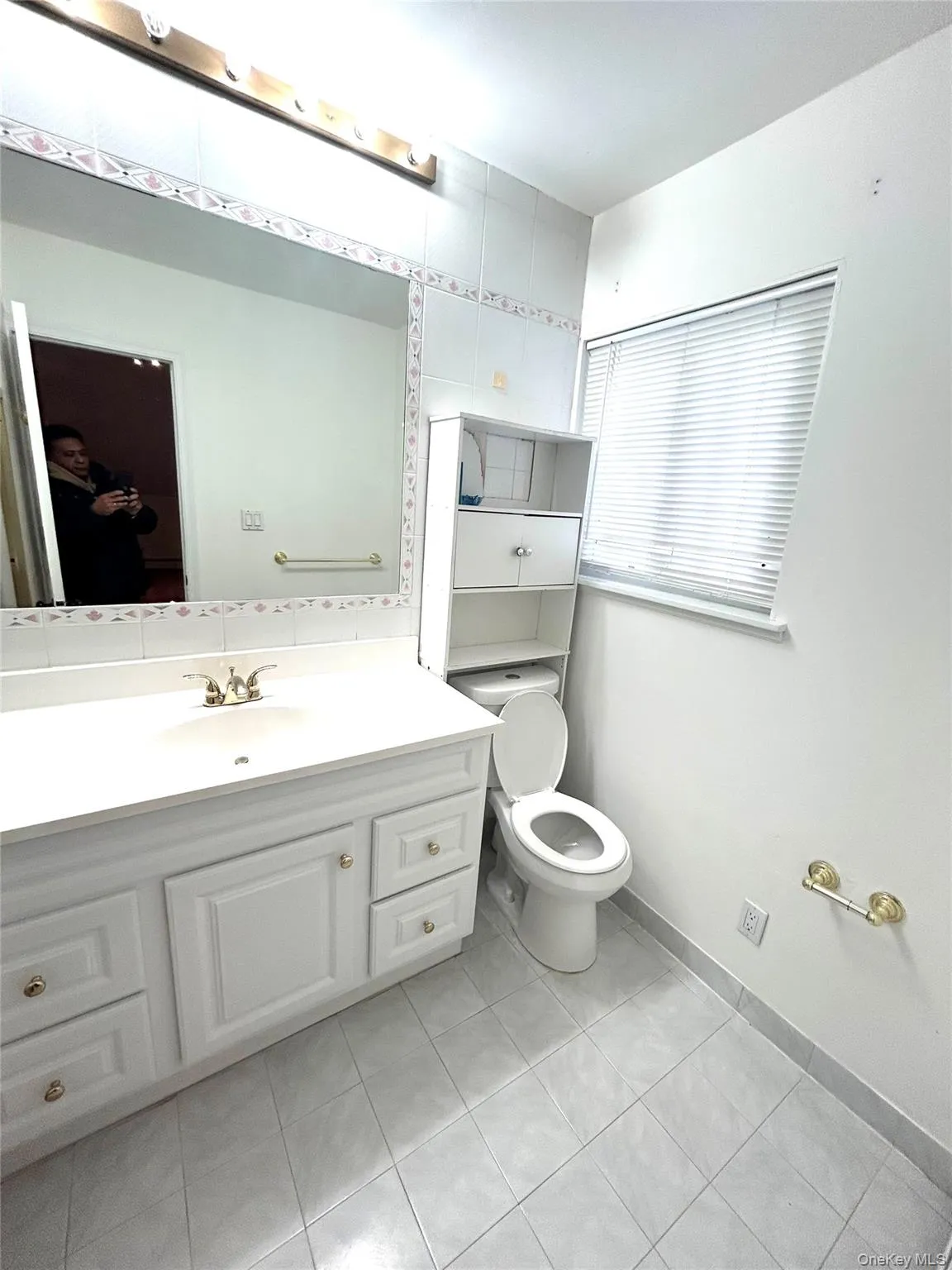 Bathroom with vanity and light tile patterned floors Bathroom with vanity and light tile patterned floors