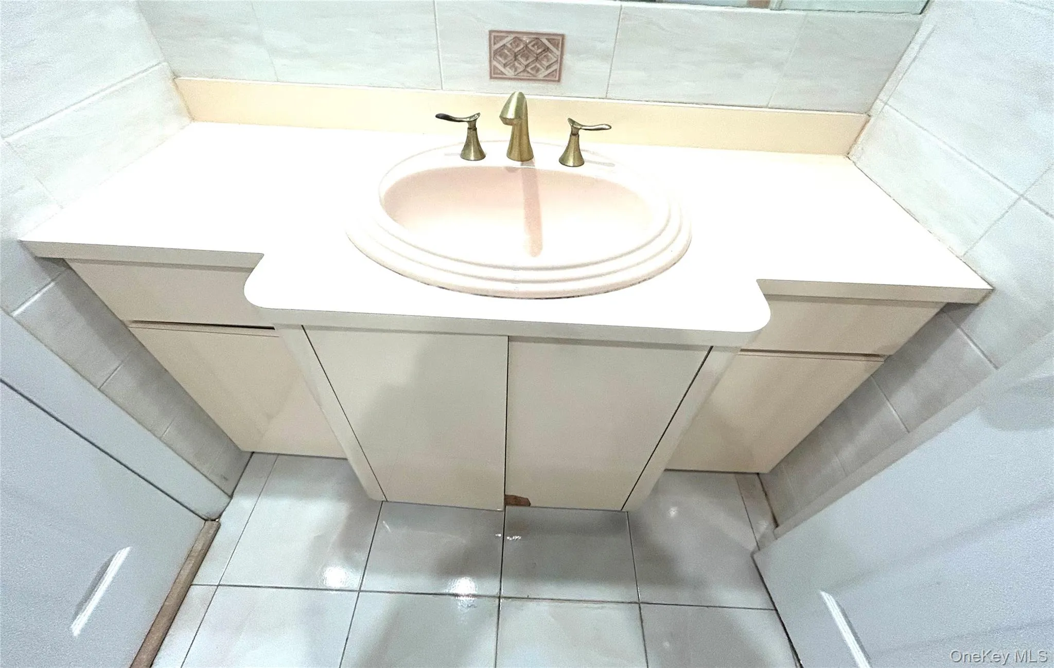 Bathroom featuring vanity and tile patterned flooring Bathroom featuring vanity and tile patterned flooring