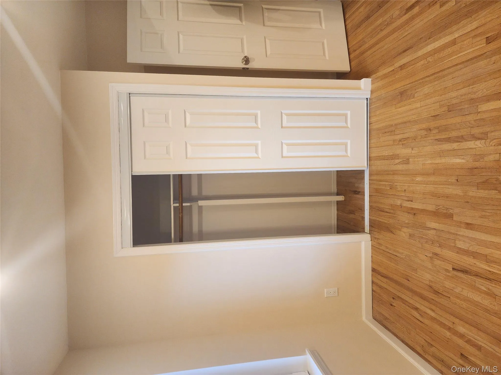 Unfurnished bedroom with light wood finished floors and a closet Unfurnished bedroom with light wood finished floors and a closet