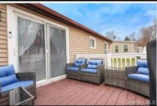 Wooden deck featuring an outdoor living space Wooden deck featuring an outdoor living space