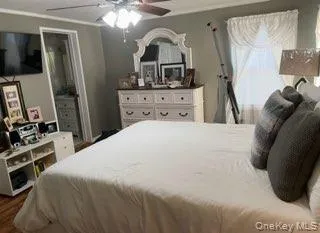 Bedroom featuring a ceiling fan Bedroom featuring a ceiling fan
