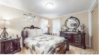 Bedroom with light wood finished floors Bedroom with light wood finished floors
