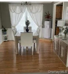 Dining room with dark wood finished floors Dining room with dark wood finished floors