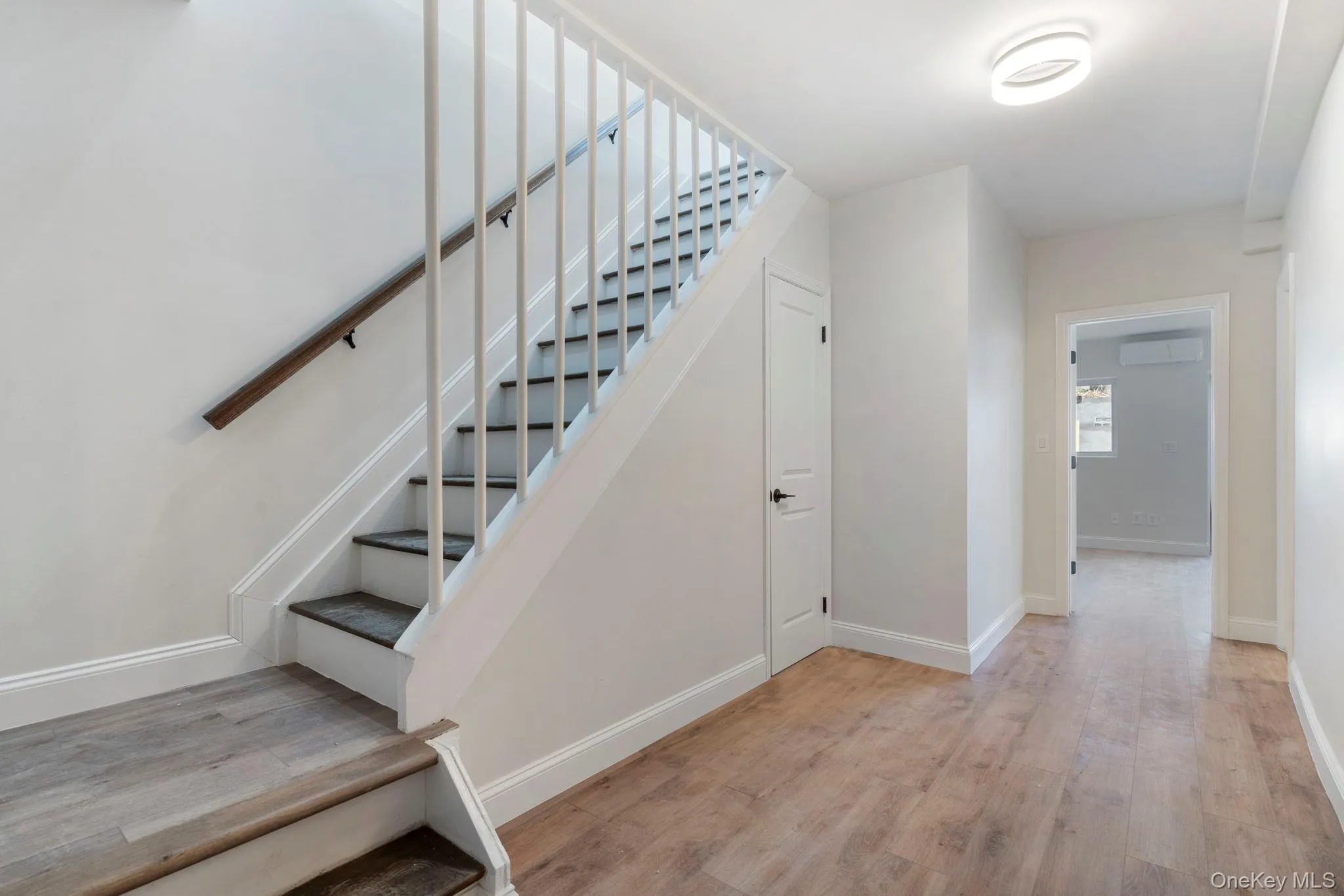 Stairway with wood finished floors and baseboards Stairway with wood finished floors and baseboards