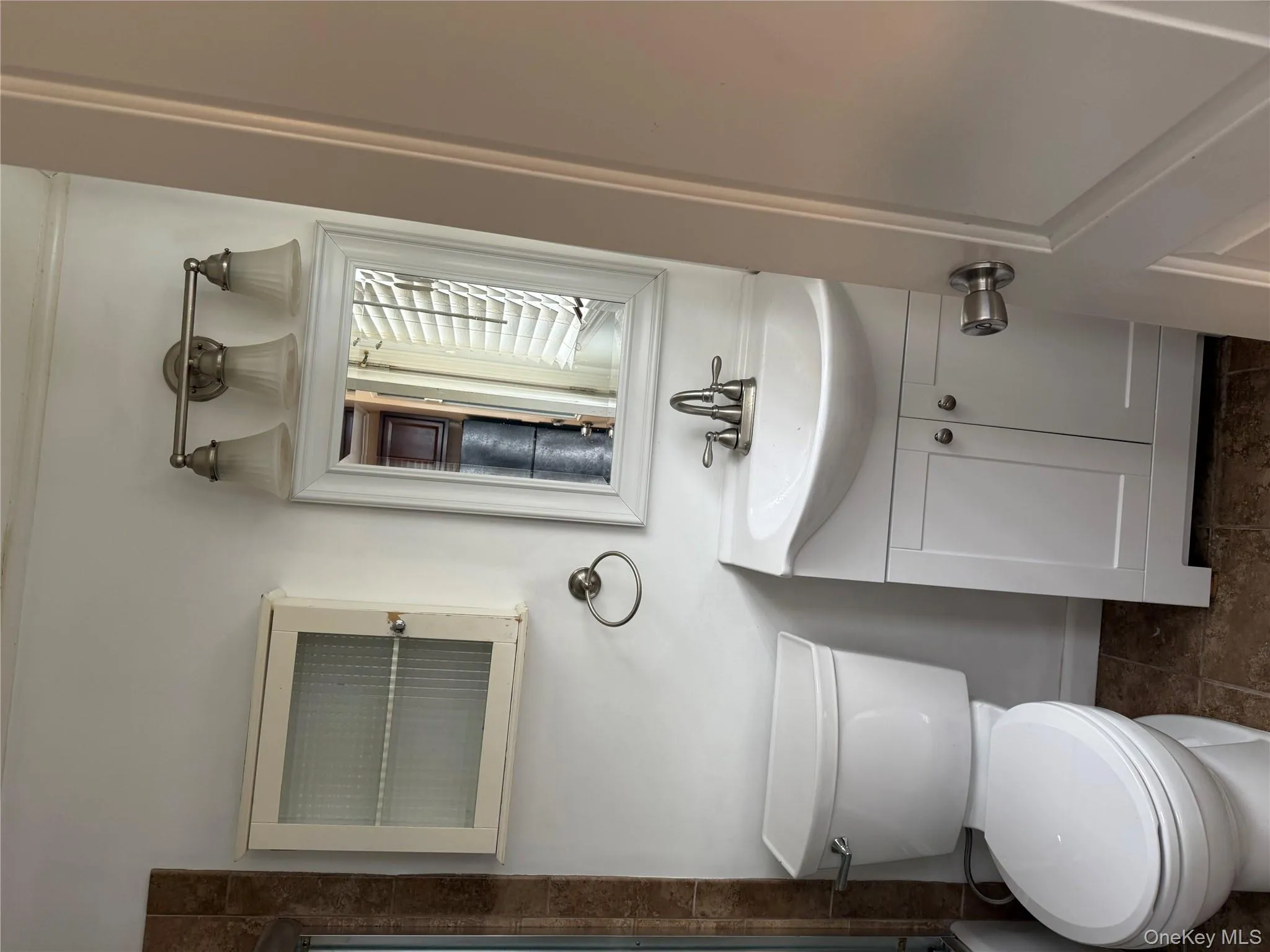 Bathroom featuring vanity and combined bath / shower with glass door Bathroom featuring vanity and combined bath / shower with glass door