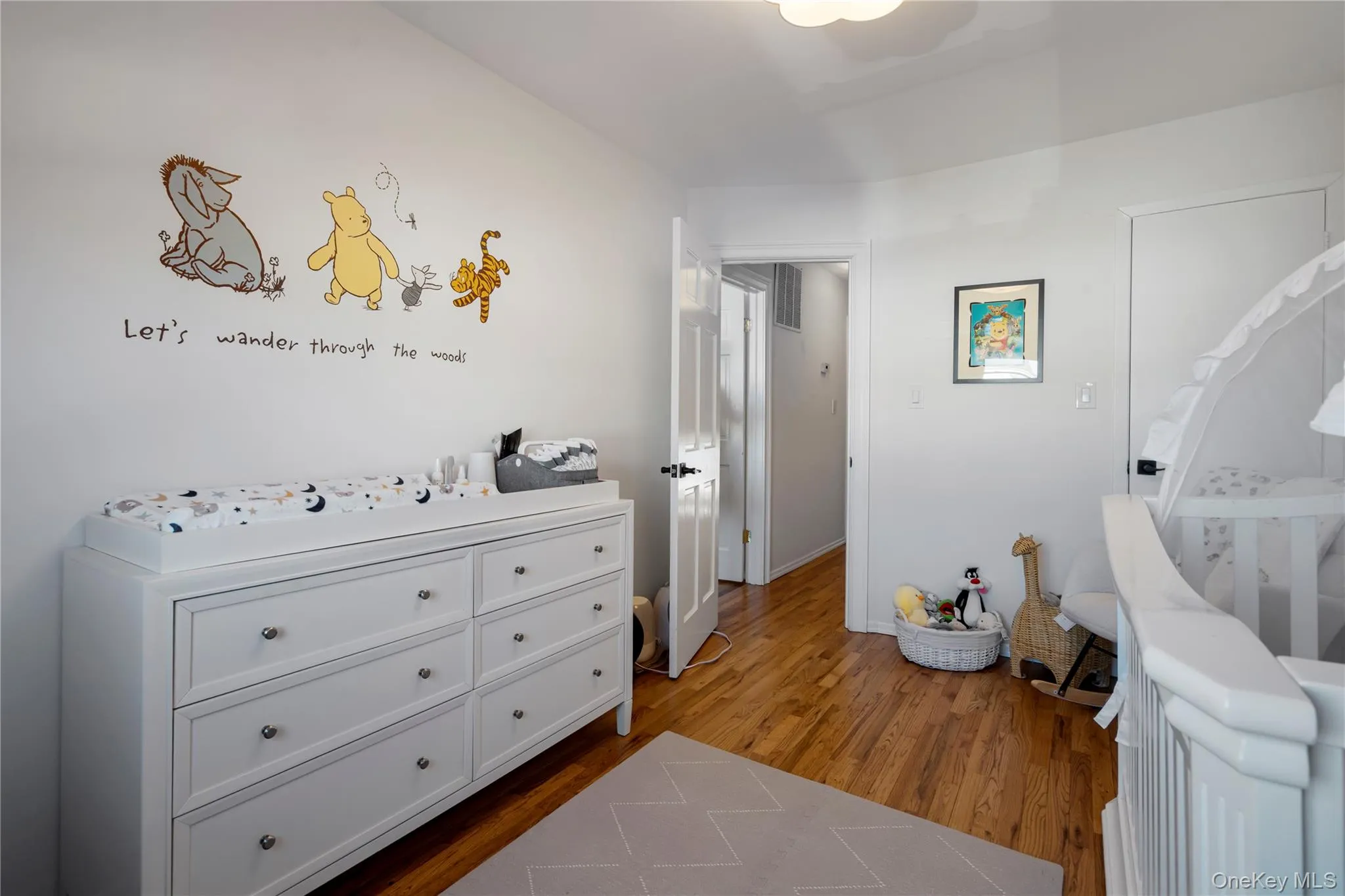 Bedroom featuring dark wood finished floors Bedroom featuring dark wood finished floors