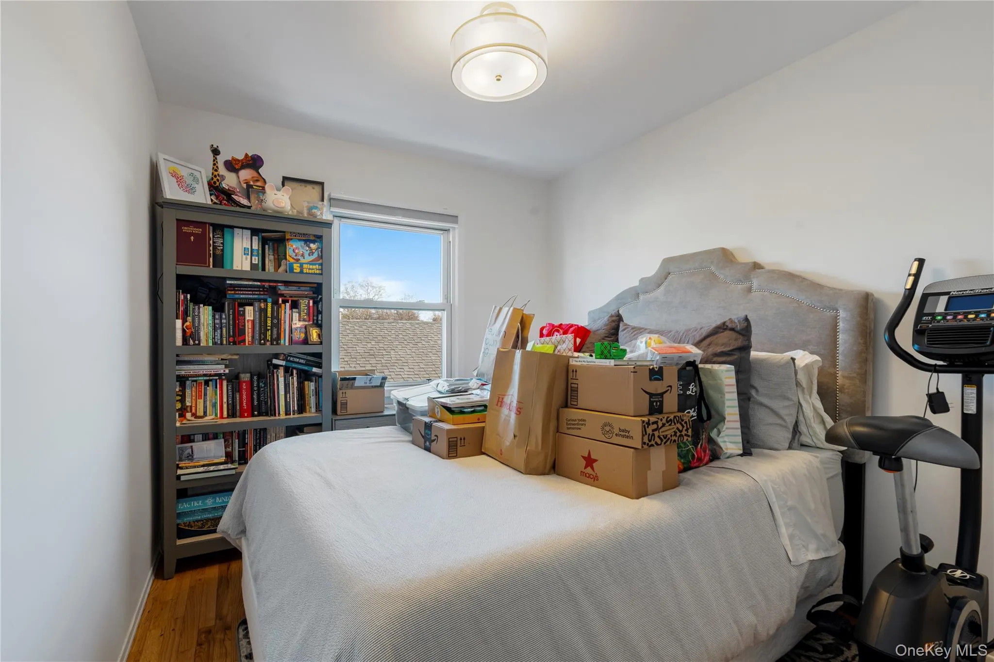Bedroom with wood finished floors and baseboards Bedroom with wood finished floors and baseboards