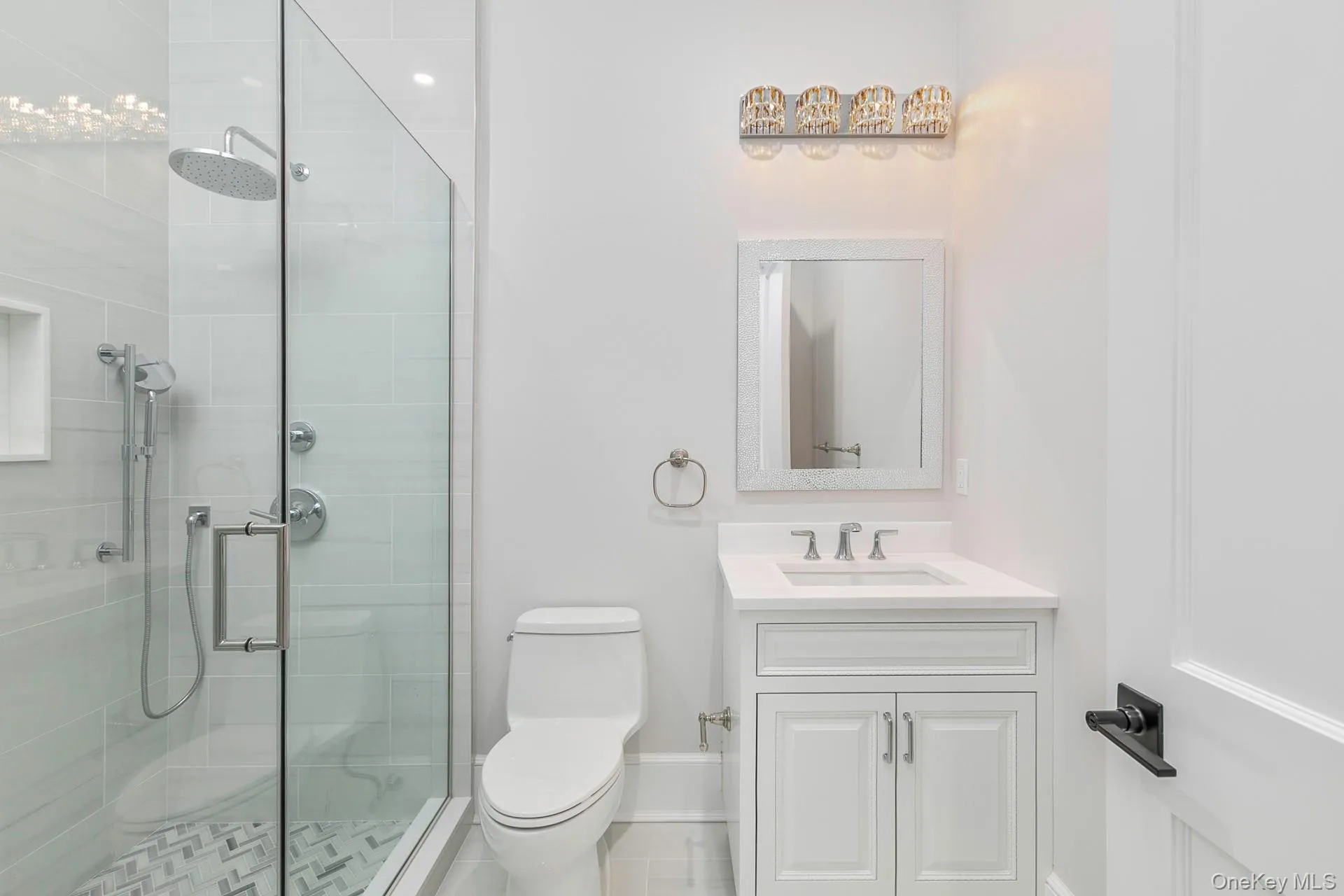 Bathroom featuring vanity and a shower stall Bathroom featuring vanity and a shower stall