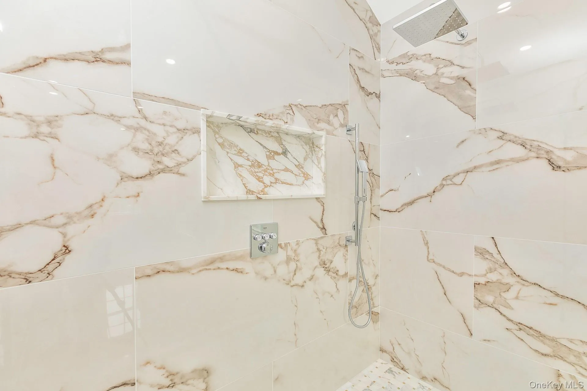 Full bath with a marble finish shower Full bath with a marble finish shower