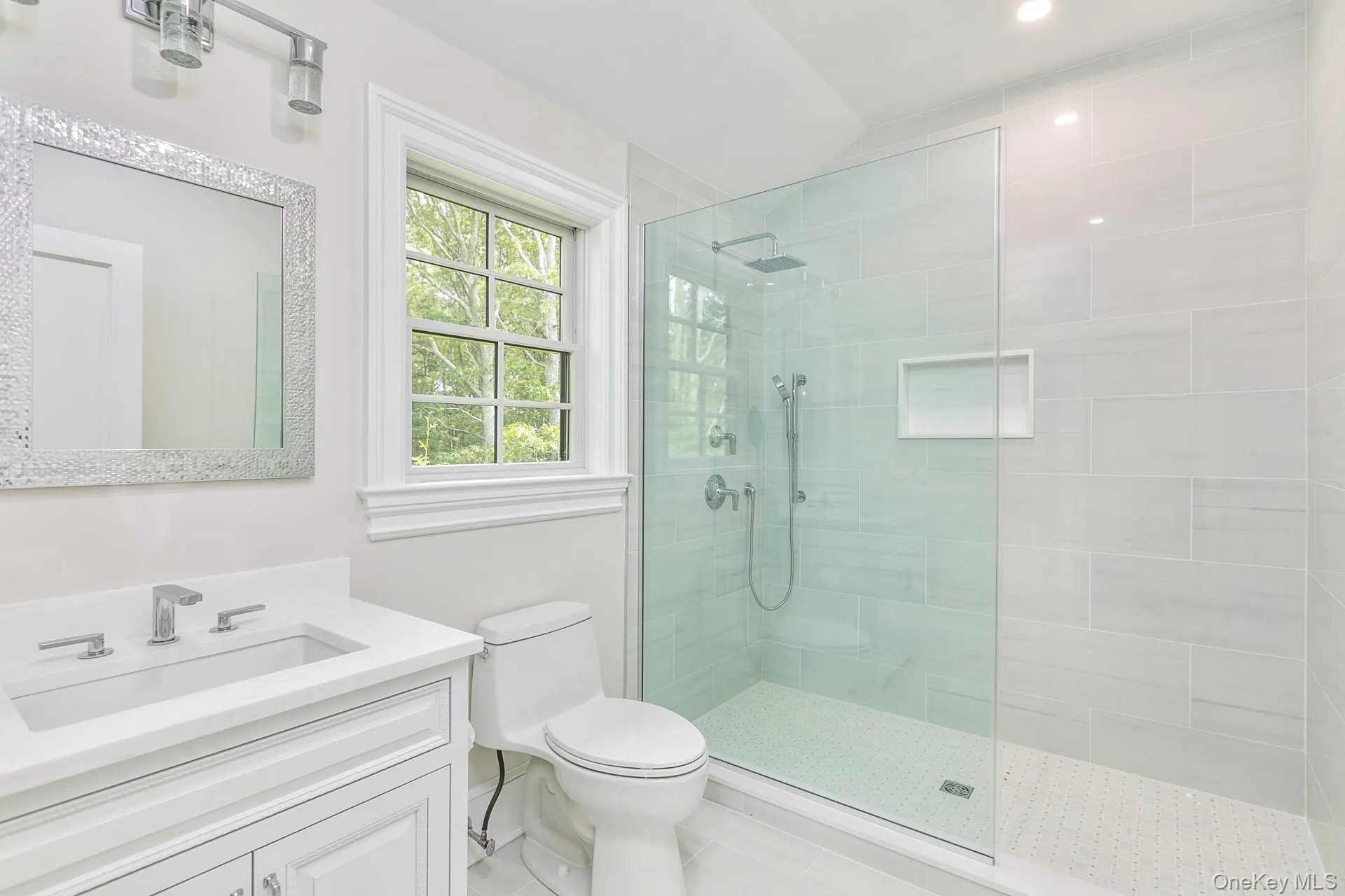 Bathroom featuring vanity and a walk in shower Bathroom featuring vanity and a walk in shower