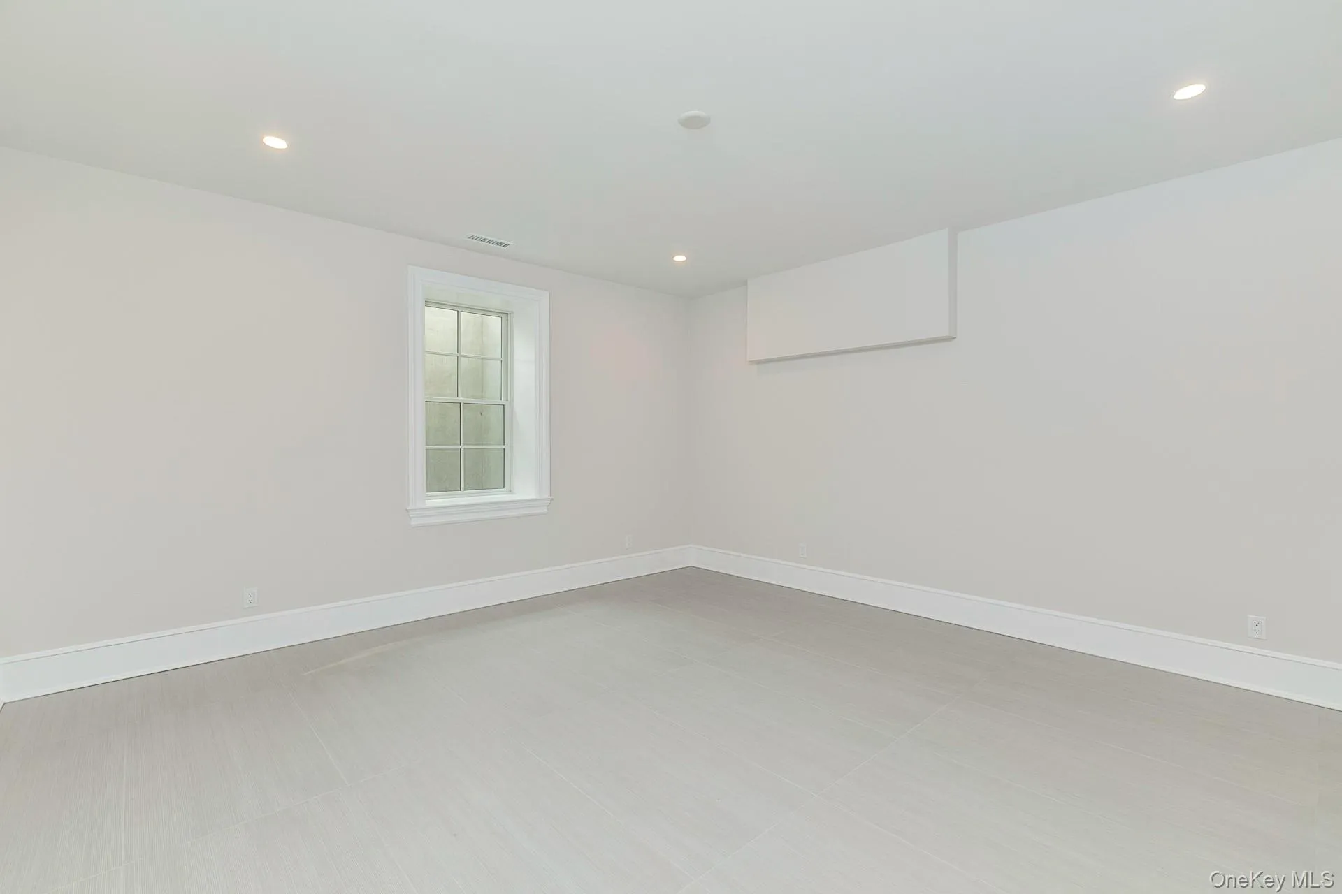 Empty room featuring recessed lighting Empty room featuring recessed lighting