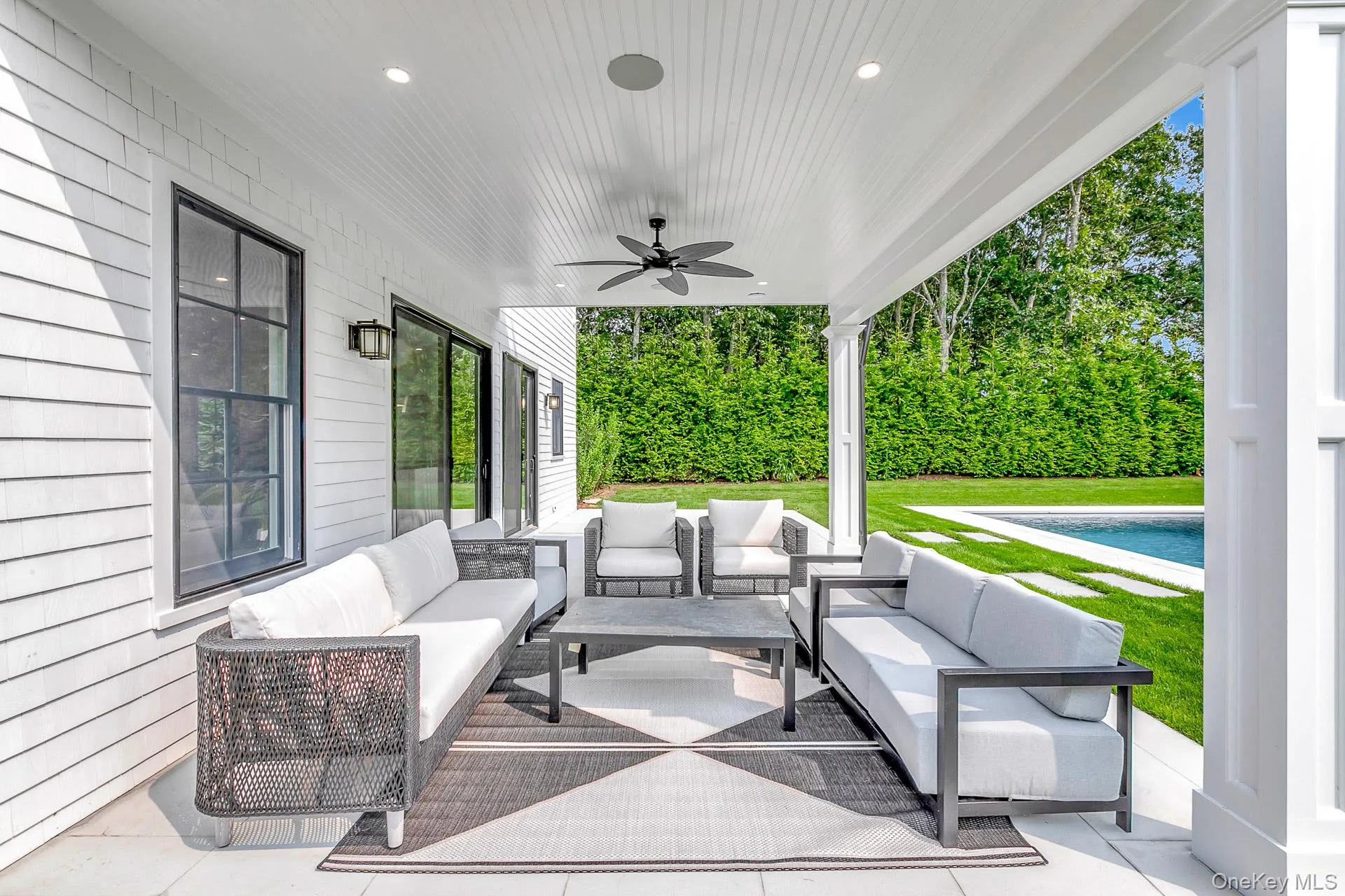 View of patio with ceiling fan, an outdoor pool, and outdoor lounge area View of patio with ceiling fan, an outdoor pool, and outdoor lounge area