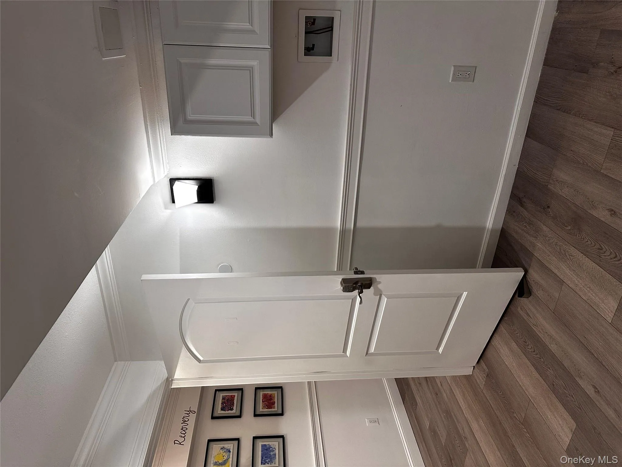 Detailed view of crown molding and wood finished floors Detailed view of crown molding and wood finished floors