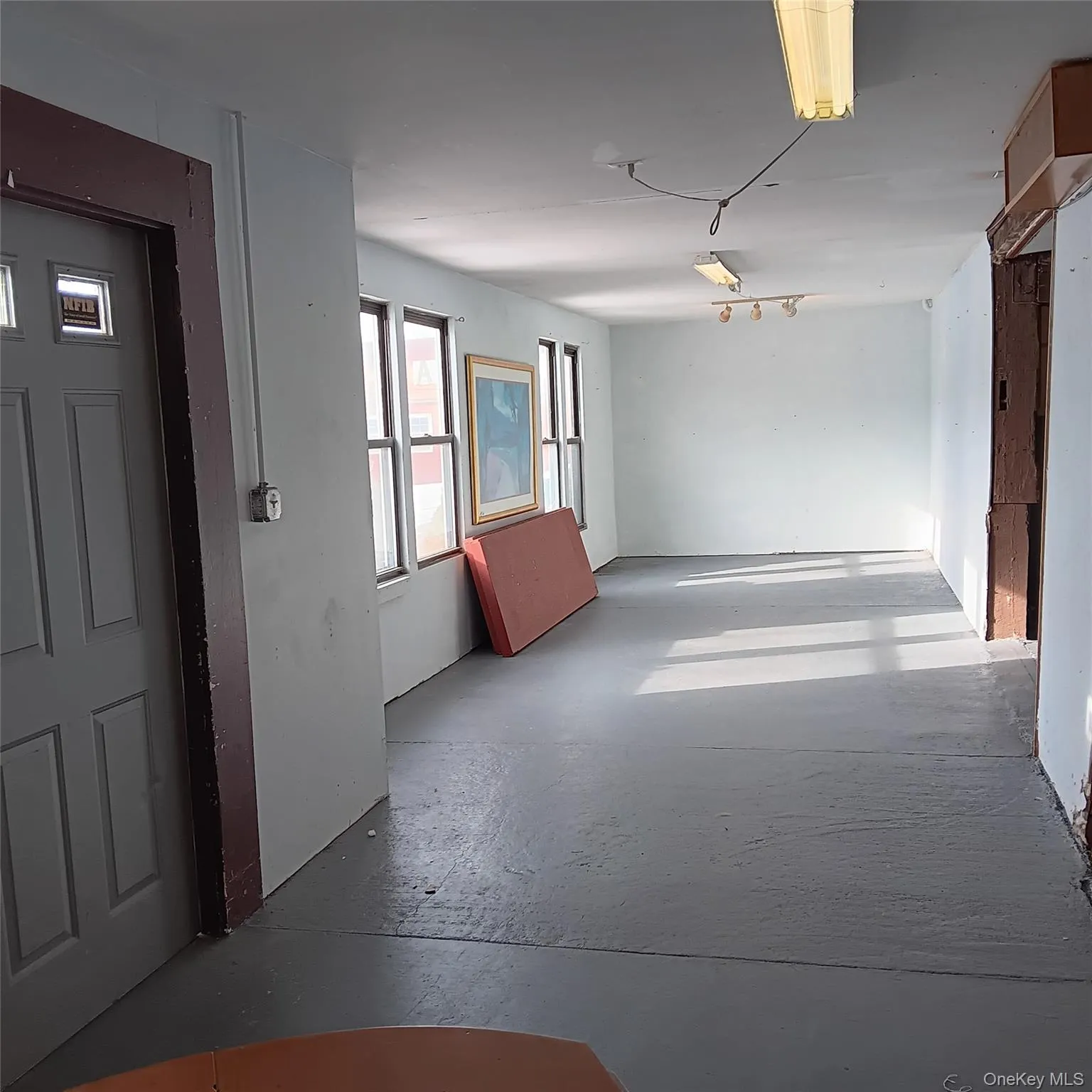 Hallway with concrete flooring Hallway with concrete flooring