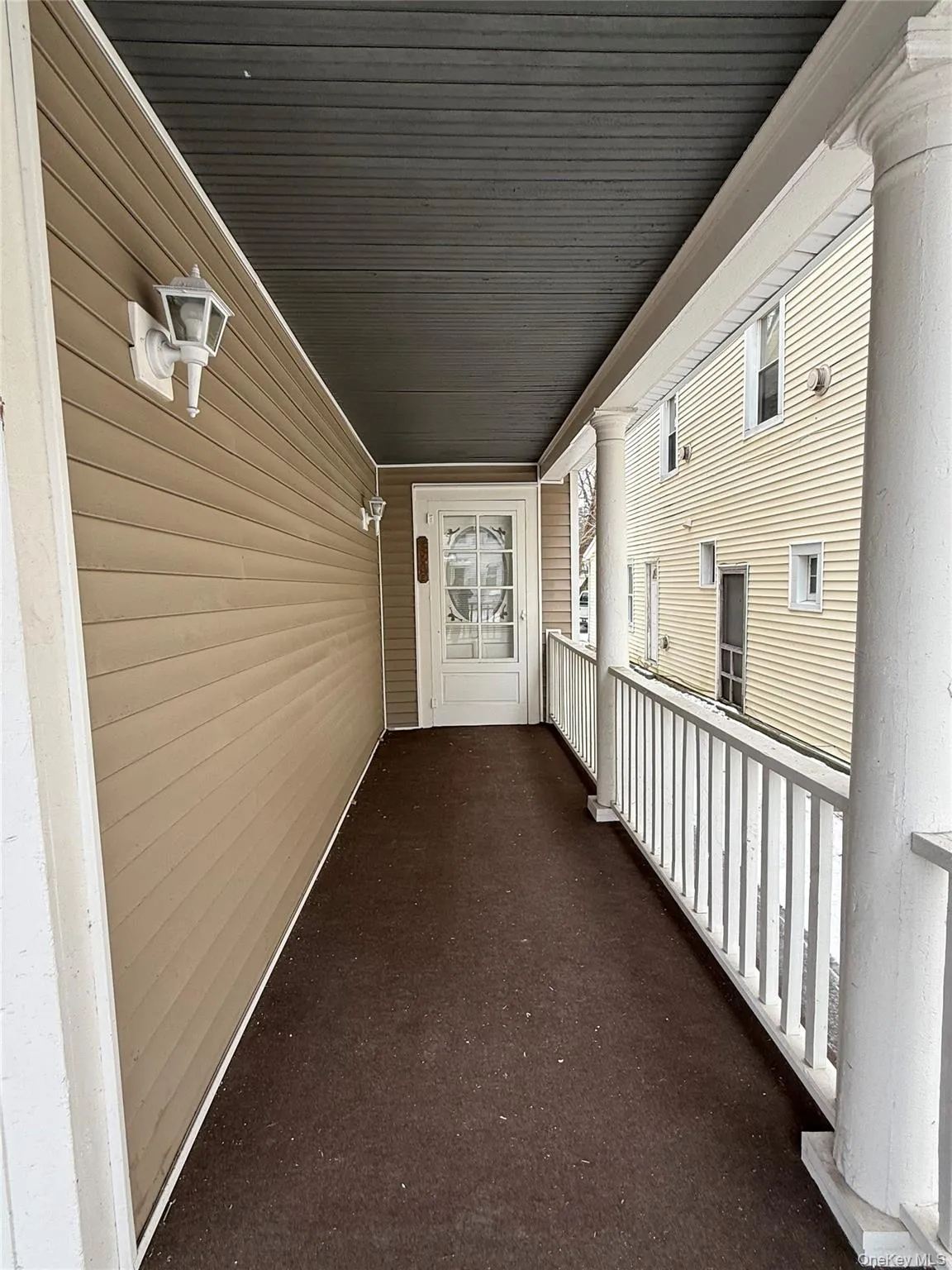 View of exterior entry featuring covered porch View of exterior entry featuring covered porch