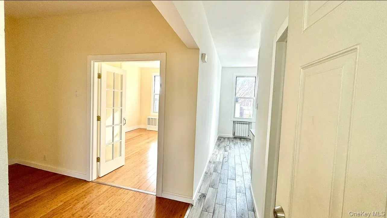 Corridor featuring light wood-style flooring Corridor featuring light wood-style flooring