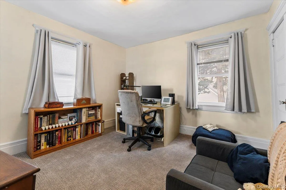 Office space featuring carpet and baseboards Office space featuring carpet and baseboards