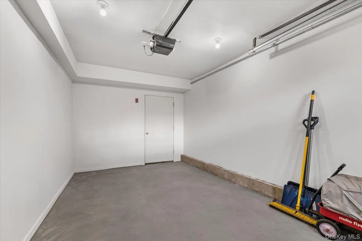 Garage featuring a garage door opener Garage featuring a garage door opener